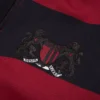 Pantalon de survêtement à ourlet ouvert « Striped Crest » rouge/bleu marine